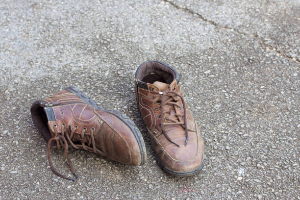 istock Old brown leather shoes on the floor. 639384690