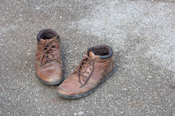 istock Old brown leather shoes on the floor. 639384830
