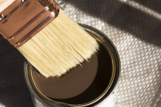 Open varnish can and new brush.