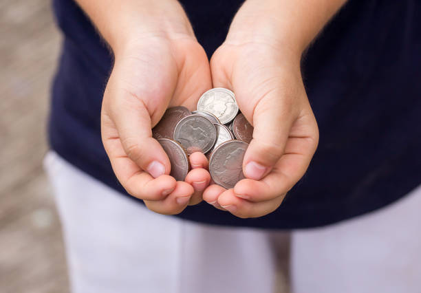 istock Close up coin in children hand 639385918