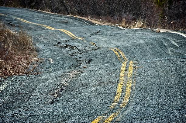 Permafrost damage to a road in the Canadian arctic. stock photo