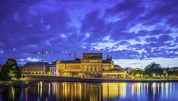 stockholm illuminated waterfront reflecting kungliga operan kunstradgarden panorama sweden - kungliga imagens e fotografias de stock