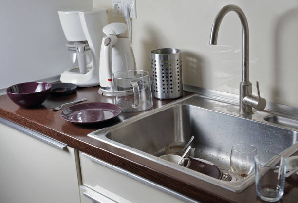 istock Dirty dishes in a kitchen sink 639391742