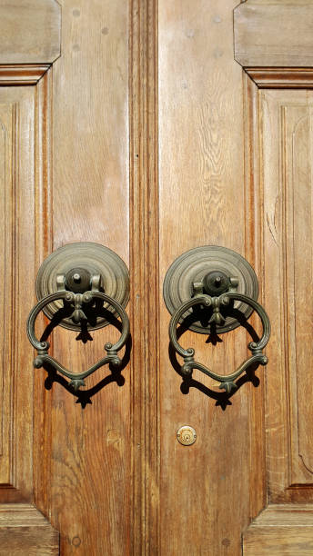 istock Old wooden doors with metal knocker 639393780