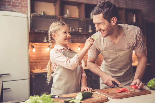 istock Father and daughter cooking 639393942