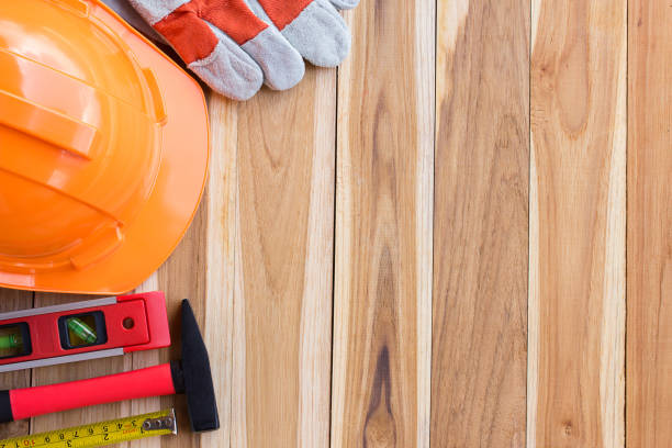 istock Safety equipment and tool kit on wooden table 639394064