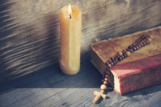 cross, book and candle - confessional nun imagens e fotografias de stock