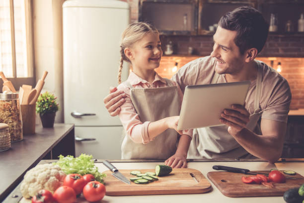 istock Father and daughter cooking 639394684