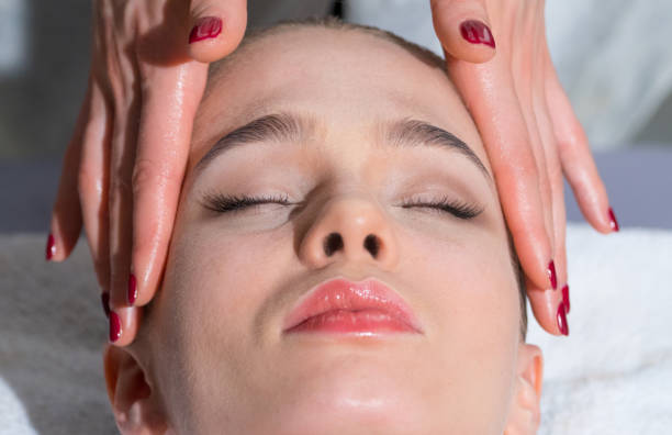 istock Girl doing facial massage 639394746