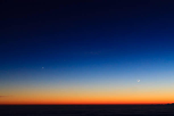 istock Mountain  silhouette over clouds,sky at twilight with moon 639394846