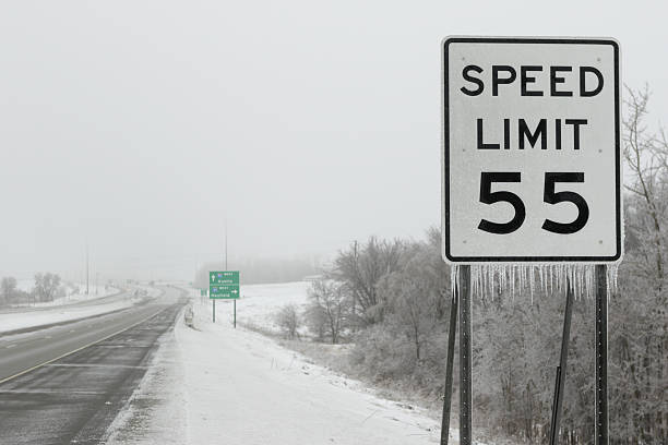 Icicles Hanging From Speed Limit Sign Along Icy Highway
