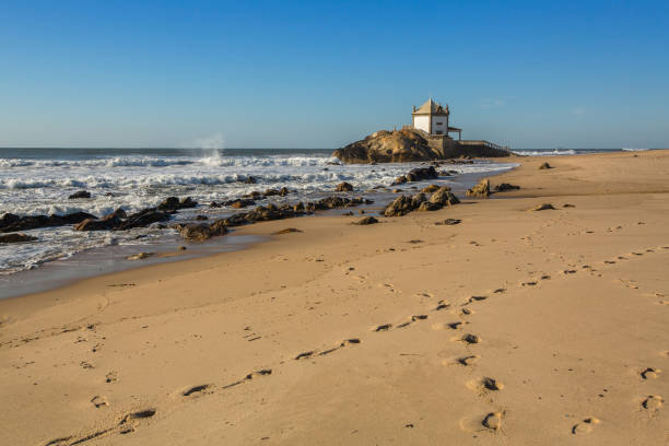 Miramar Beach (Miramar Beach) and chapel Senhor da Pedra, near Porto, Portugal.