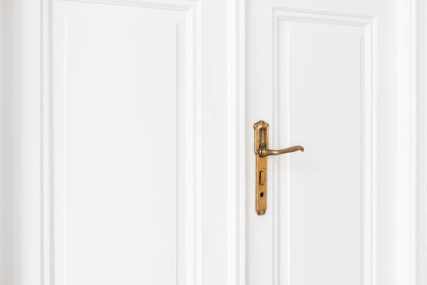 istock old door handle  on white door 639398028