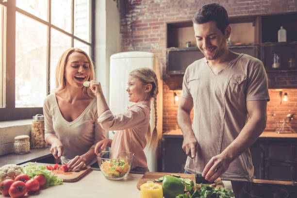istock Young family cooking 639398578