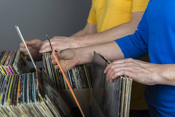 istock couple searching records in a music store 639399098