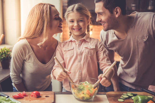 istock Young family cooking 639399350