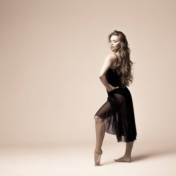 istock Ballet dancer woman black dress. Studio shot. 639399520