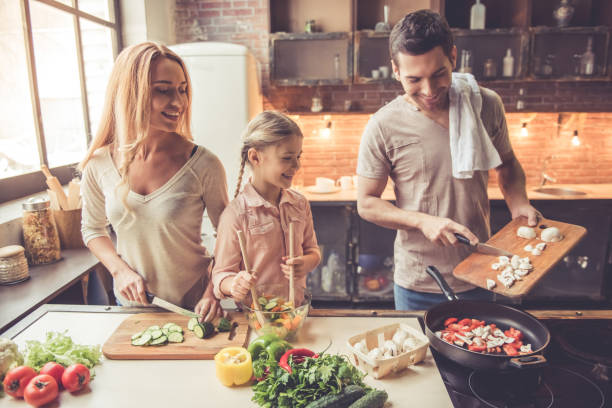 istock Young family cooking 639399844