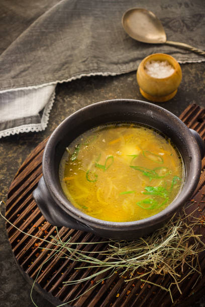 istock Soup in clay bowl on chopping board. 639400154