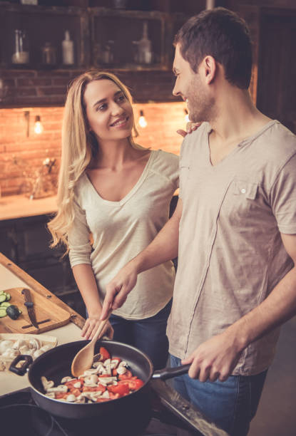 istock Beautiful couple cooking 639401810