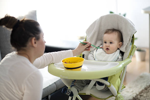 istock Mother feeding her baby 639402112