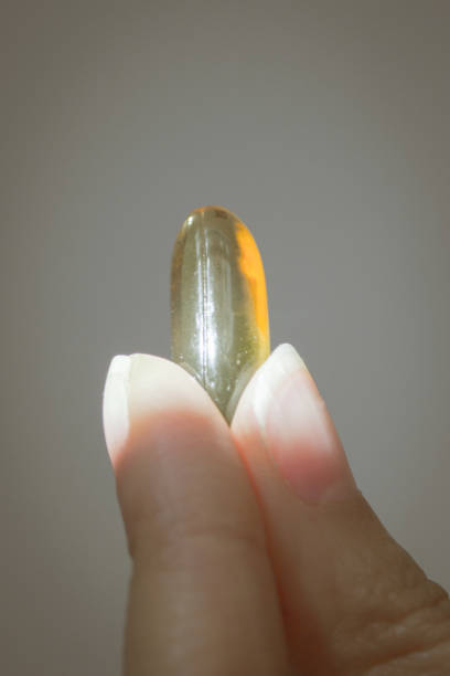 istock Oil capsule held by a woman 639402430