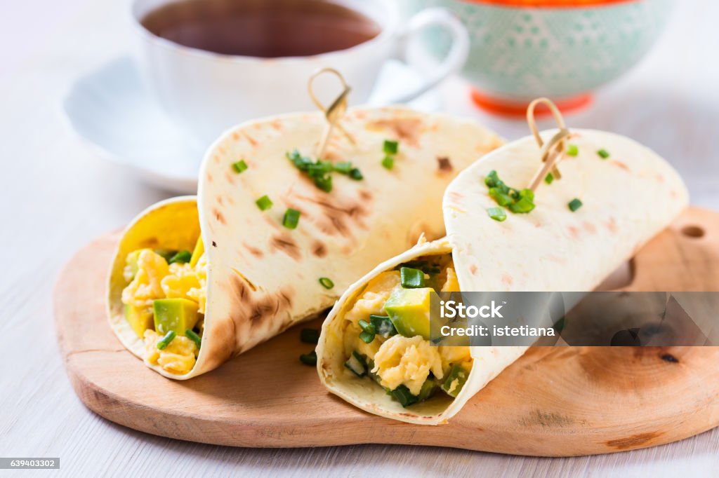 Avocado scrambled egg wraps Homemade avocado scrambled egg wraps for healthy breakfast Wrap Sandwich Stock Photo