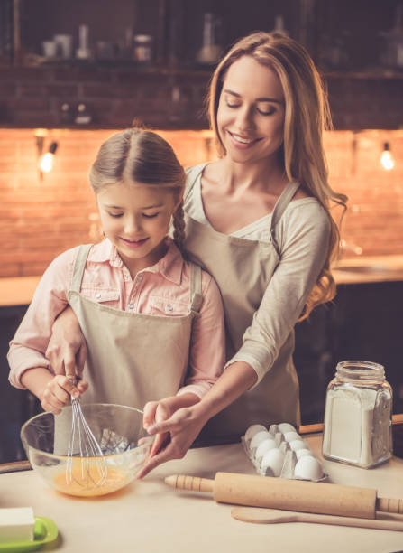 istock Mother and daughter baking 639404094
