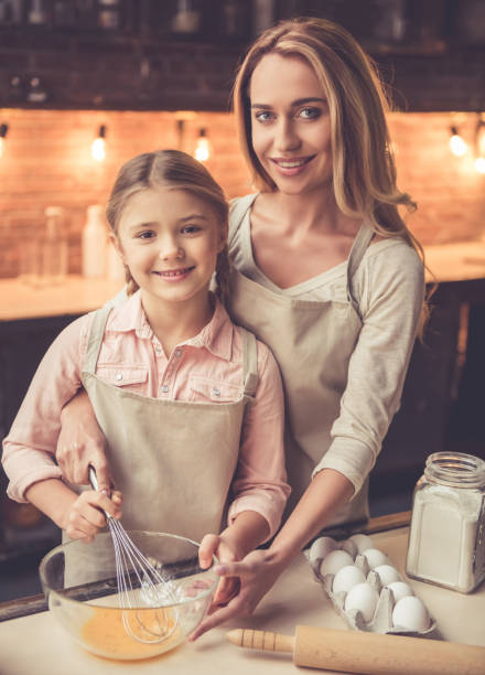 istock Mother and daughter baking 639404292