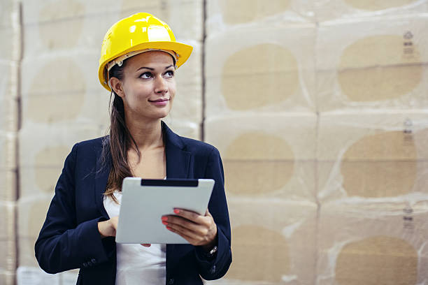 istock Busineswoman checking warehouse stock with digital tablet 639405812