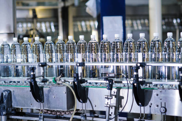 istock water bottles on the a production line 639406546