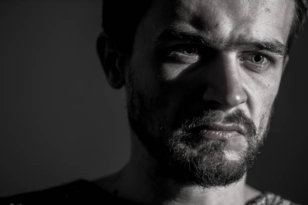 istock young man, sad emotions, black and white photography 639407562