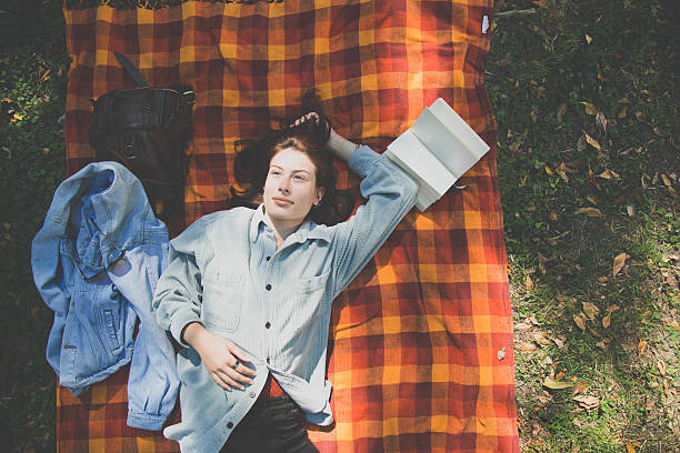 istock Woman lying on blanket 639411690