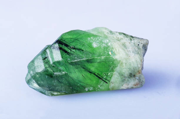 Olivine crystal A Olivine crystal from Sapat Gali Kaghan valley Pakistan. crystalline inclusion complex stock pictures, royalty-free photos & images