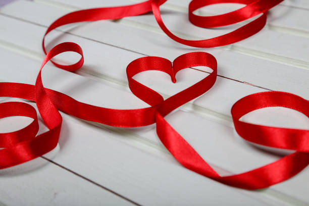 istock Valentine's day. Heart from red ribbon. 639412120