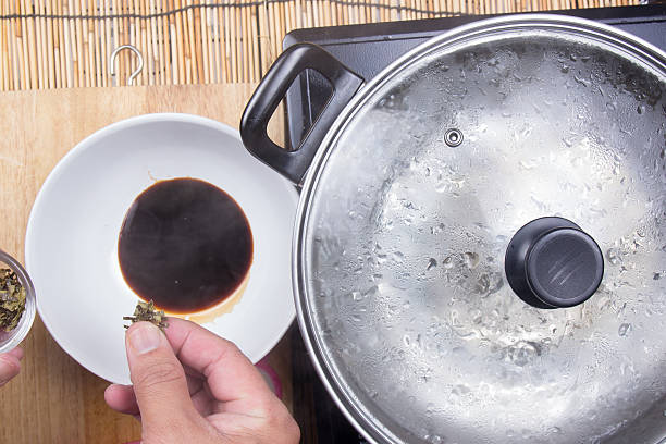 istock Chef put dry seaweed to soy sauce 639413756