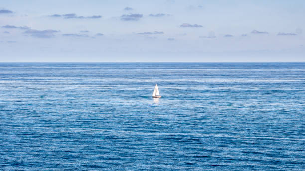 istock Sailing yacht among sky-blue currents 639414260
