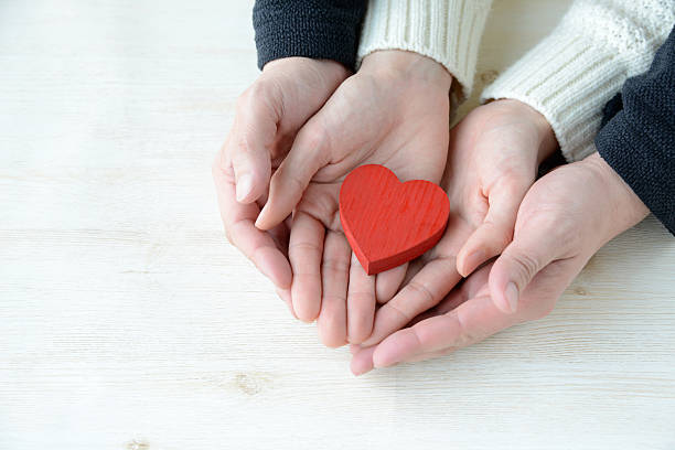 istock Love concepts, heart in hands 639414336