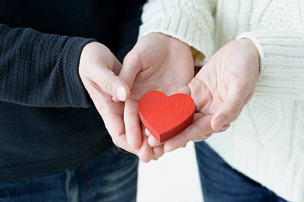 istock Love concepts, heart in hands 639414420