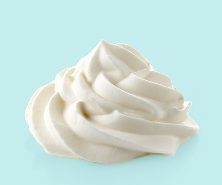 whipped cream on blue background