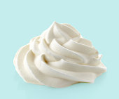 whipped cream on blue background