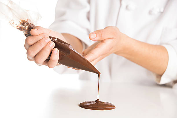 istock Pastry Chef Shaping Chocolate from a Pastry Bag 639415154