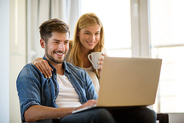 istock Couple with digital laptop 639415574