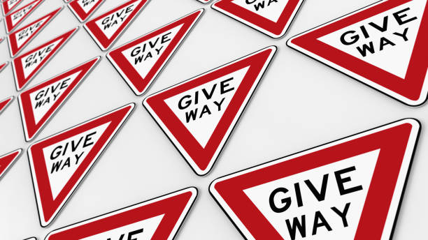 istock Ordered Grid of Give Way Signs 639418106