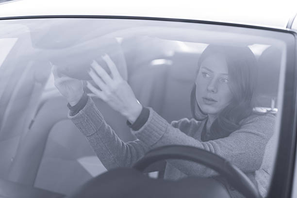 istock Beautiful girl driver, fixing make up 639419360