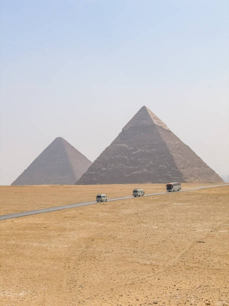 istock Many tour buses and cars driving through great pyramids 639419964