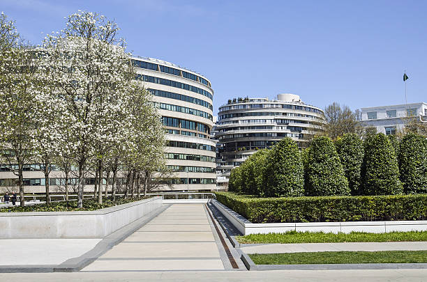 Watergate residential building with cherry blossom flowers Washington Dc, United States - April 12, 2015: Watergate residential building with cherry blossom flowers in spring and park hotel watergate stock pictures, royalty-free photos & images