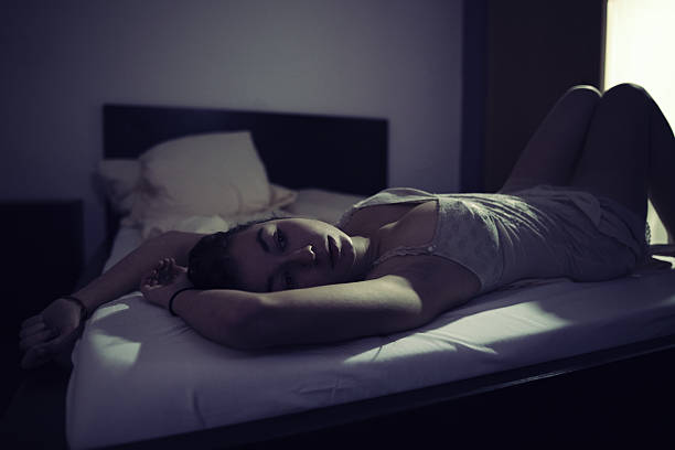 istock Sad teenager lying on the bed 639420556