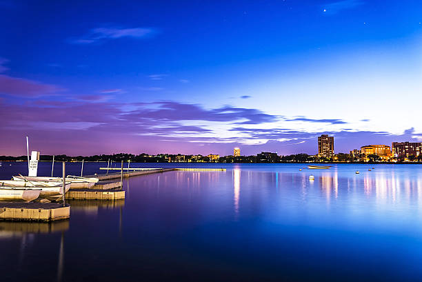Popular Lake Calhoun Dusk in the City of Lakes, Minneapolis Popular Lake Calhoun Dusk in the City of Lakes, Minneapolis minnesota lake dock stock pictures, royalty-free photos & images