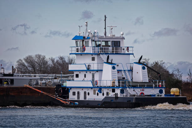 istock Marine Push Boat and Loaded Barge 639423330